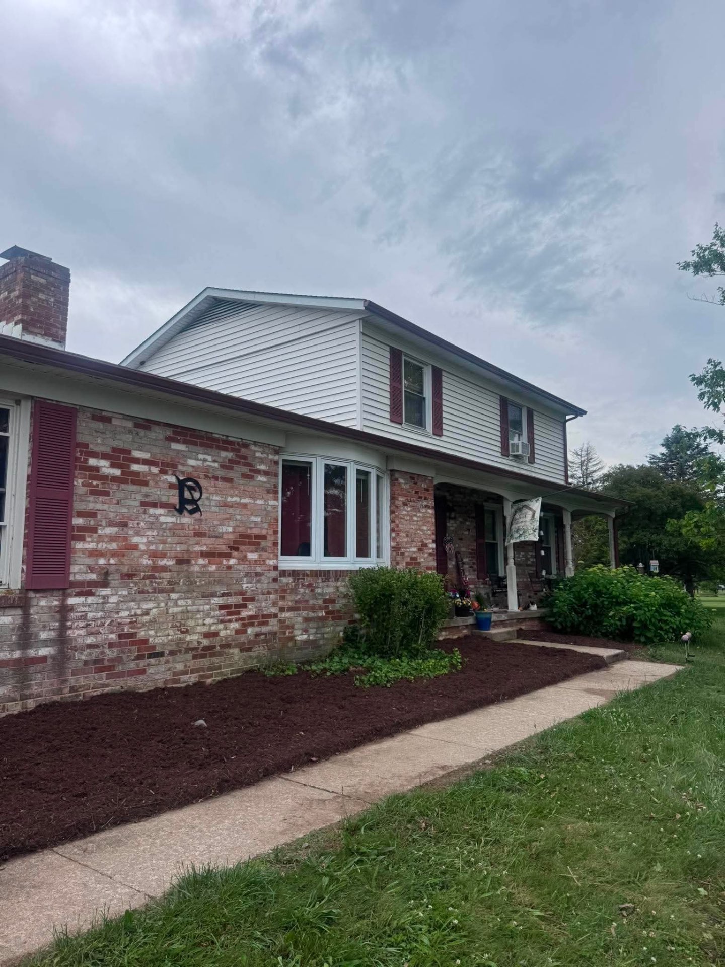 House exterior after cleanup and landscaping