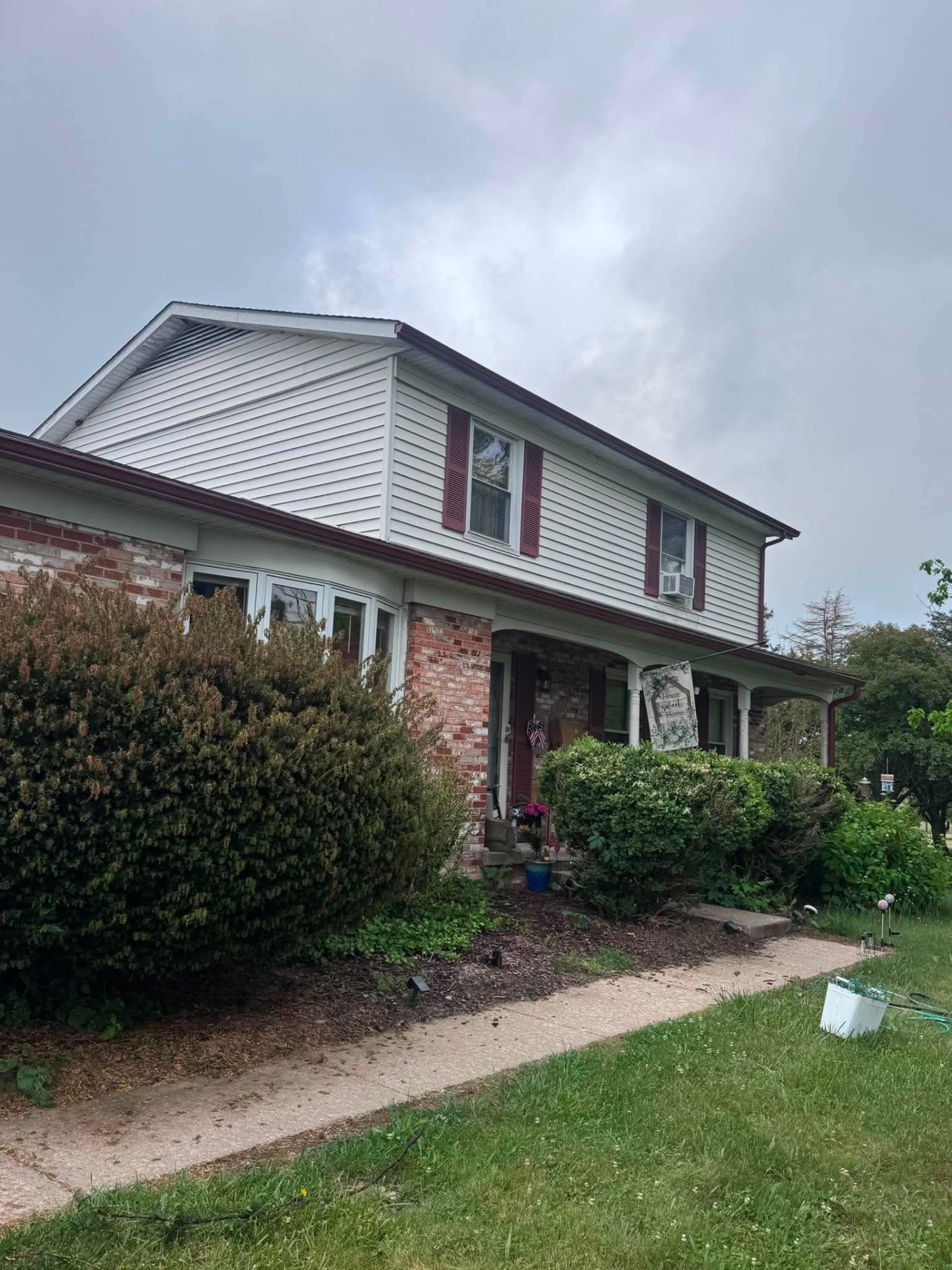 House exterior before cleanup and landscaping